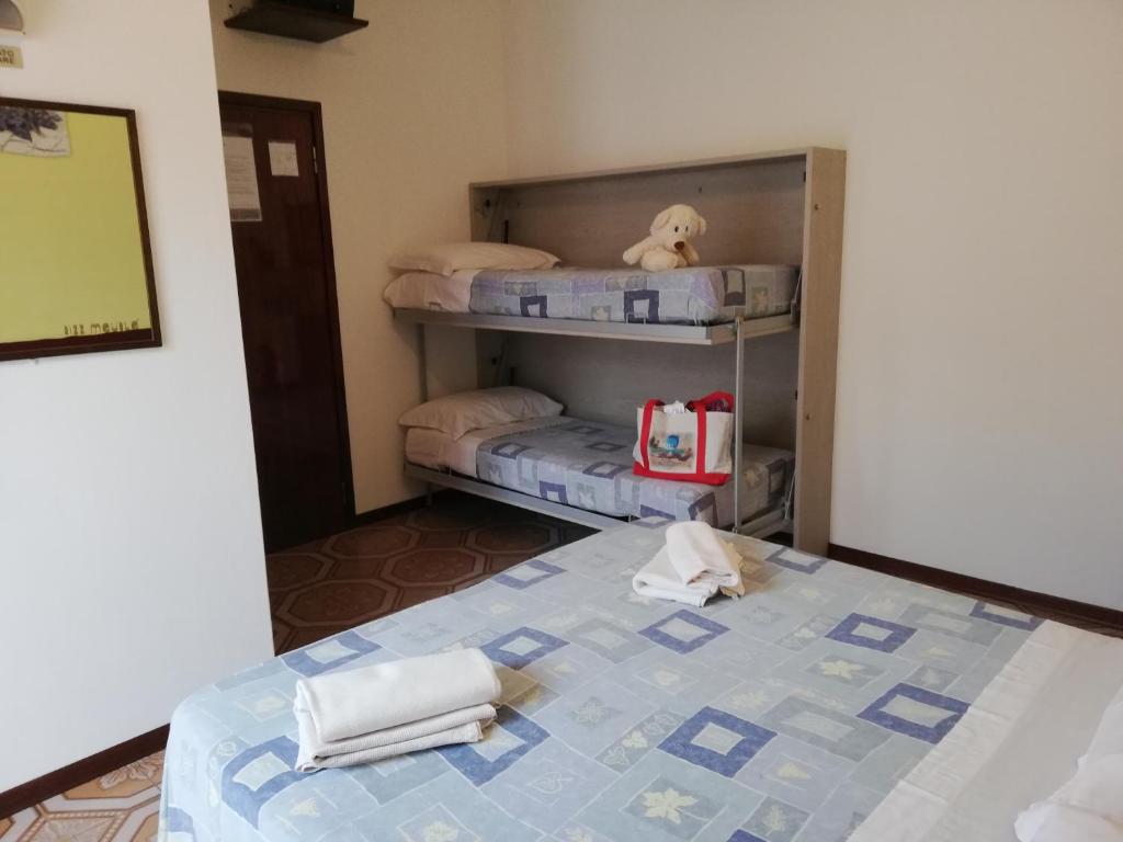 Postel nebo postele na pokoji v ubytování Hotel Cesari