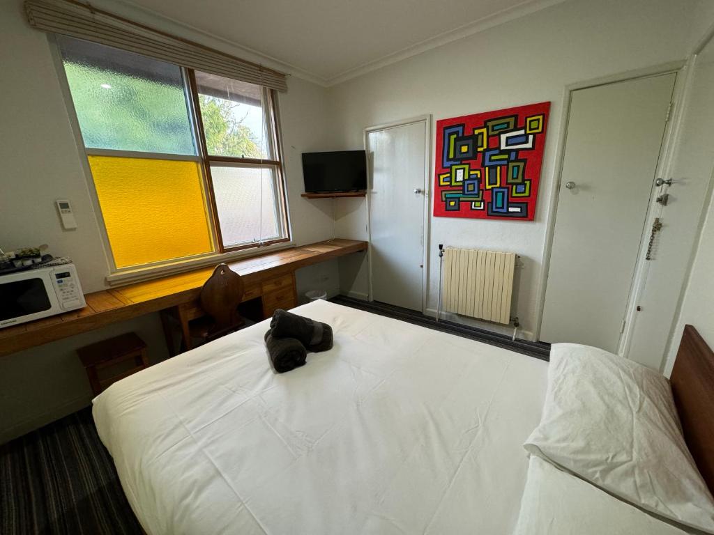 Postel nebo postele na pokoji v ubytování Bunkhouse Motel Cooma
