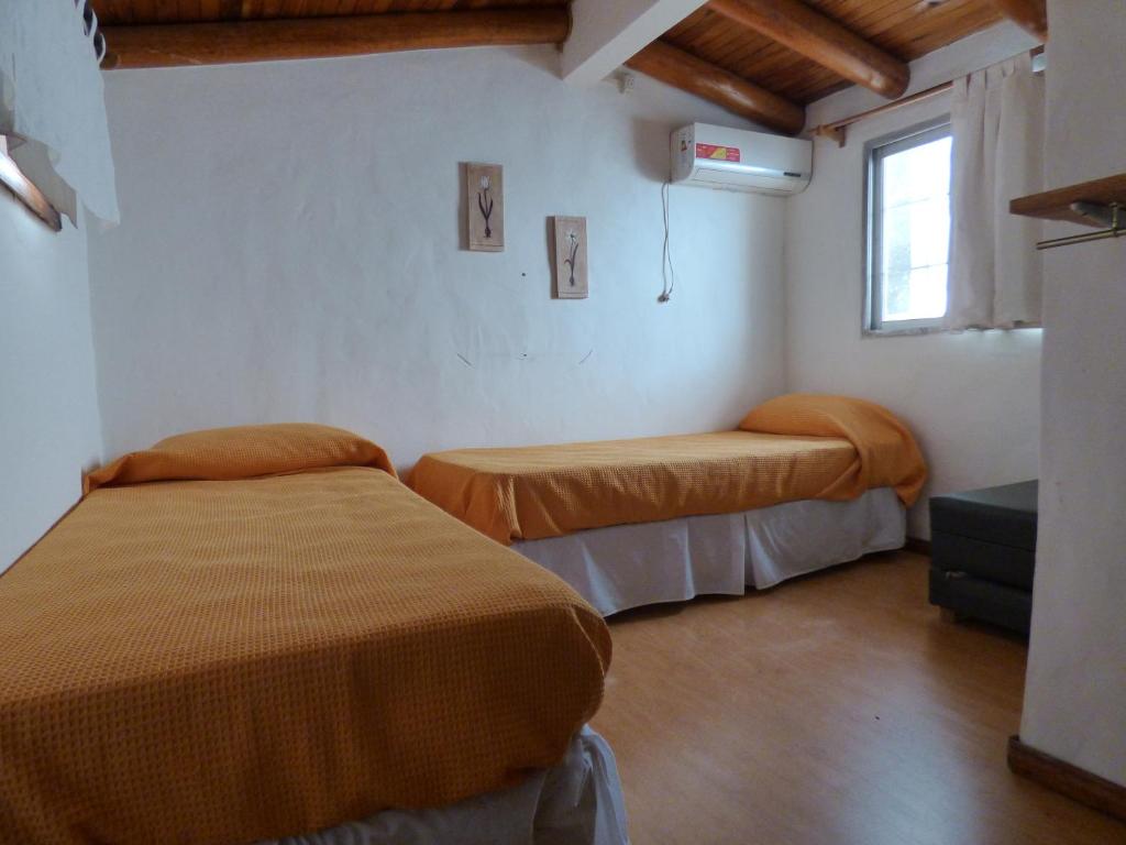 Postel nebo postele na pokoji v ubytování Cabañas EL MOLINO