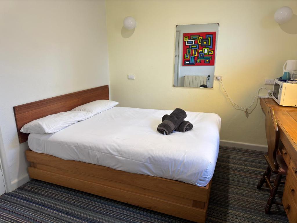 Postel nebo postele na pokoji v ubytování Bunkhouse Motel Cooma