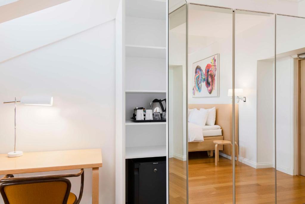 Postel nebo postele na pokoji v ubytování Radisson Blu Aleksanteri Hotel, Helsinki