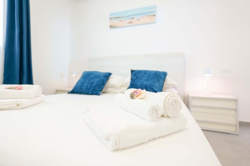 Postel nebo postele na pokoji v ubytování Il Delfino Guest House