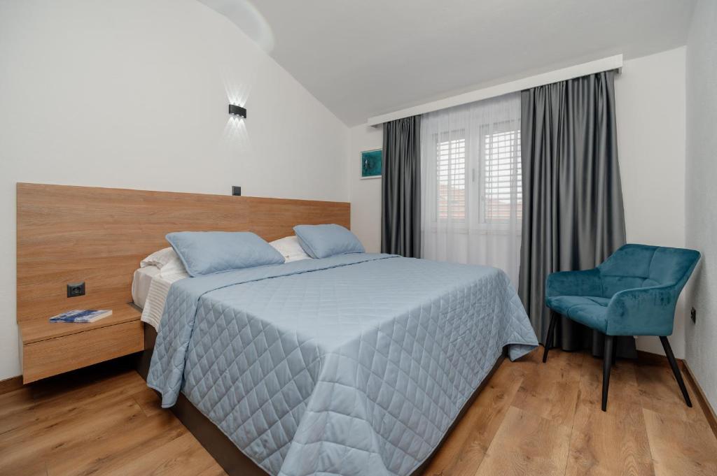 Posteľ alebo postele v izbe v ubytovaní Apartments Kudelik