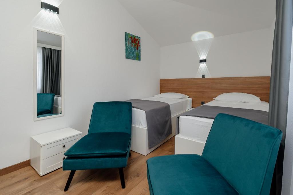 Posteľ alebo postele v izbe v ubytovaní Apartments Kudelik
