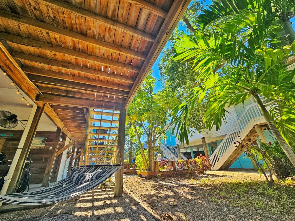 a hammock on the outside of a house at El Palmar Cottages LLC Whole House in Clearwater Beach