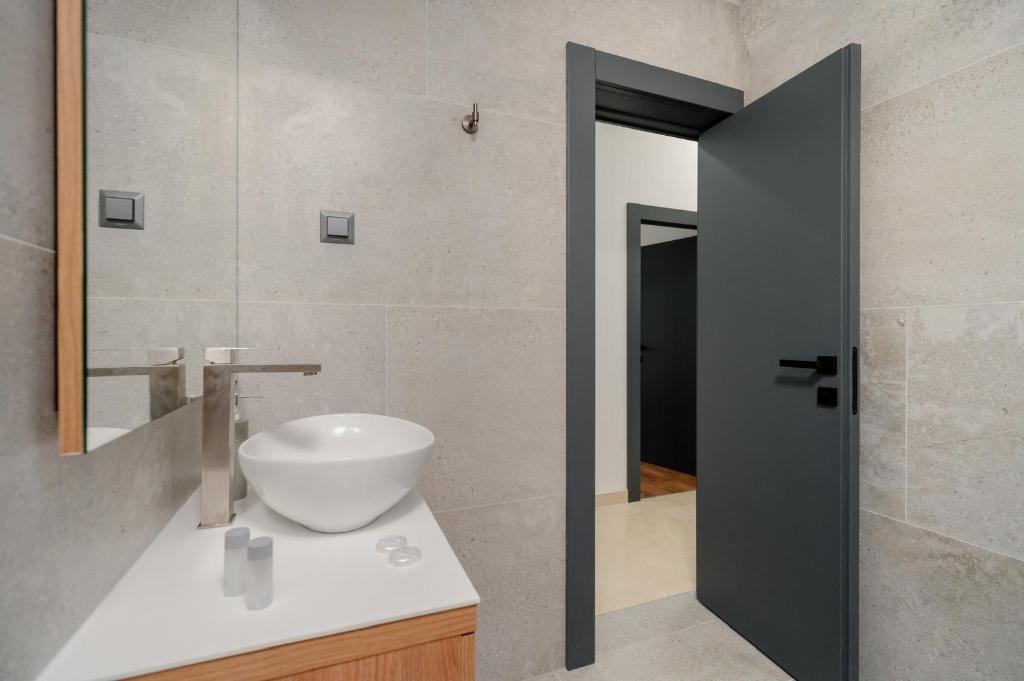 Kúpeľňa v ubytovaní Apartments Kudelik