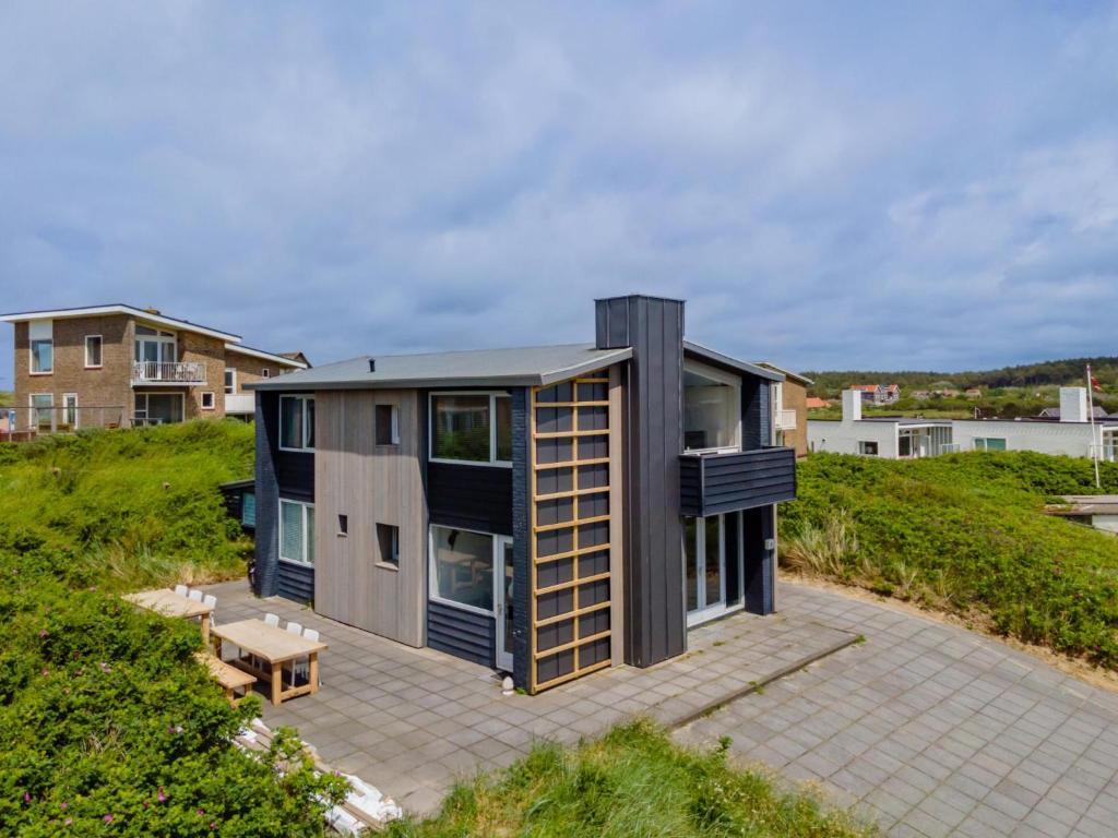 a house on a hill with a patio at Beachhouse I in Bergen aan Zee