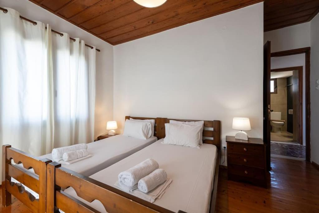 Postel nebo postele na pokoji v ubytování Chrysanthi apartments