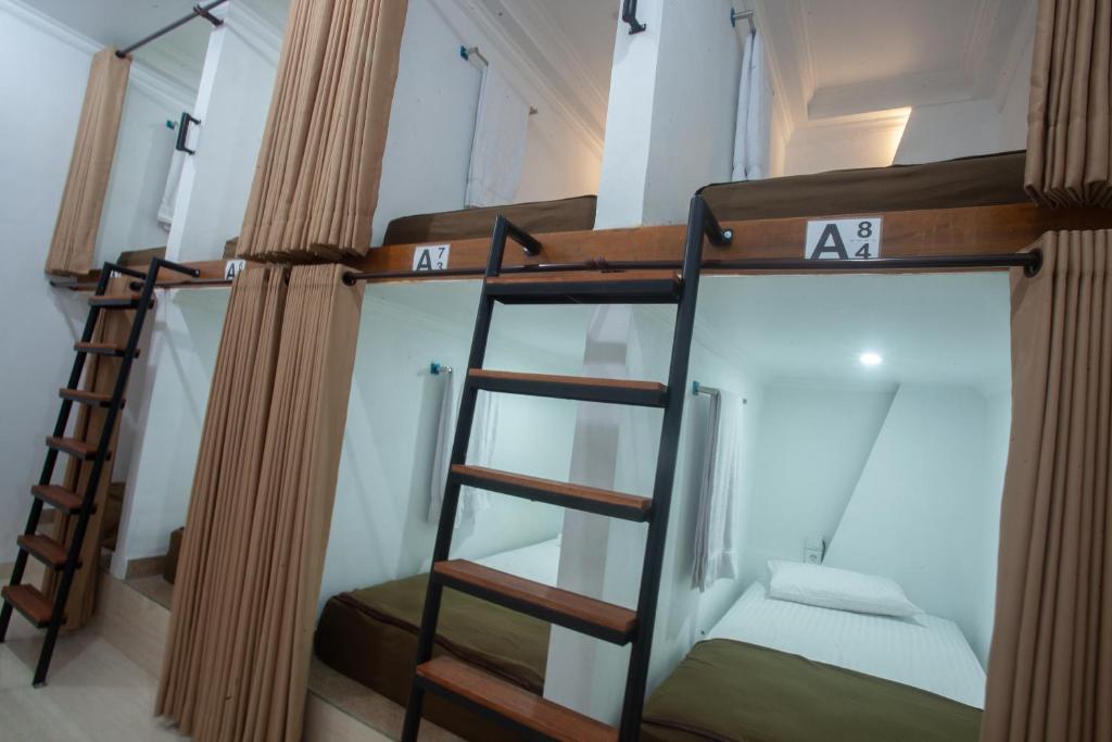 Postel nebo postele na pokoji v ubytování Lucky Hostel