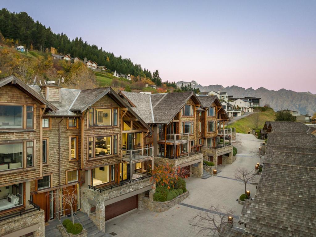 a group of houses in a town with a mountain at Karamata by MajorDomo in Queenstown