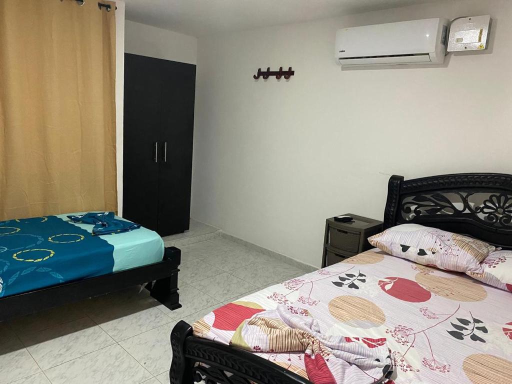 Postel nebo postele na pokoji v ubytování Piantini Houses