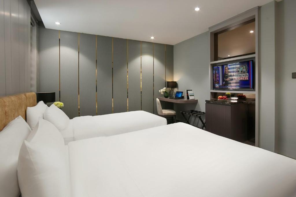 Postel nebo postele na pokoji v ubytování Ping Hotel