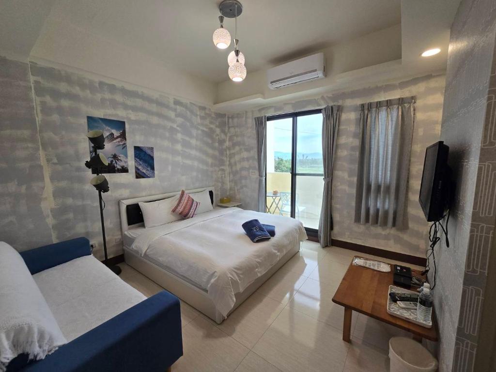 Rúm í herbergi á Shui Young B&B