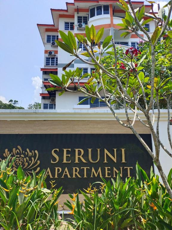 a sign in front of a building at Seruni Apartment - 3 Bedrooms in Serendah