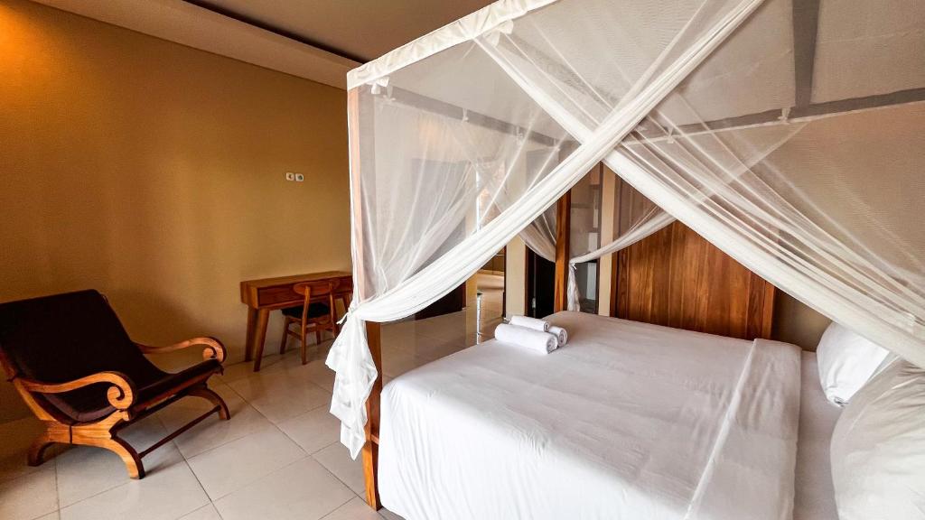 Postel nebo postele na pokoji v ubytování Wardana Ubud Villa