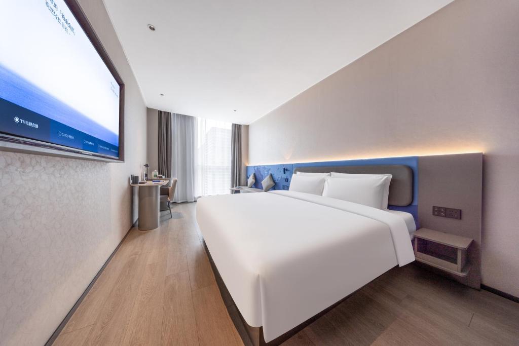 Postel nebo postele na pokoji v ubytování Atour Light Hotel Shanghai Daning International Shibei High-tech Park