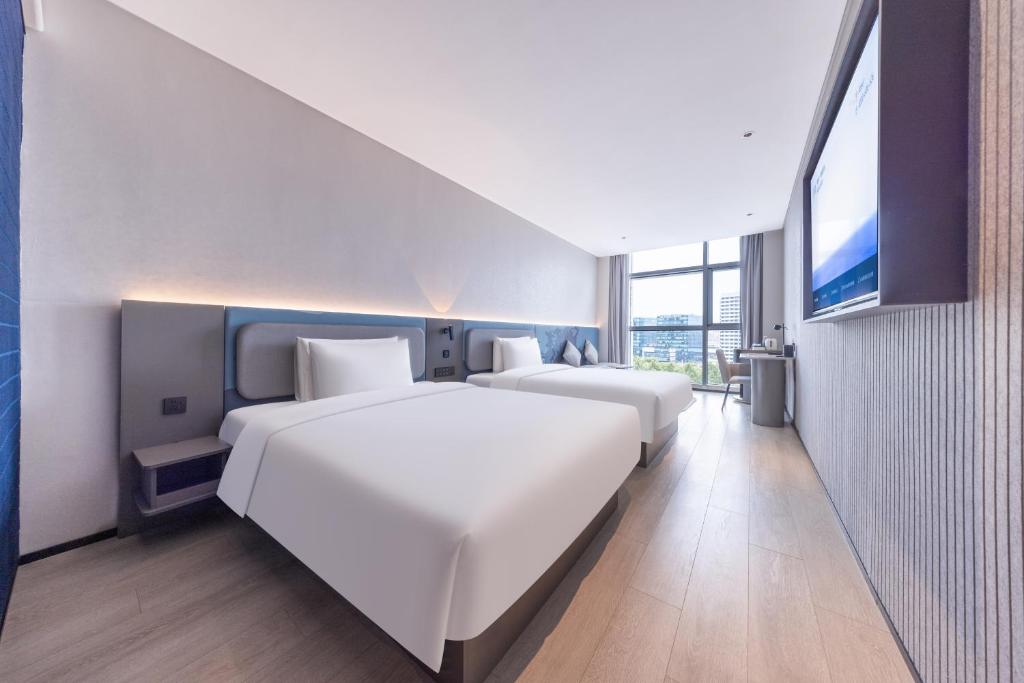 Postel nebo postele na pokoji v ubytování Atour Light Hotel Shanghai Daning International Shibei High-tech Park