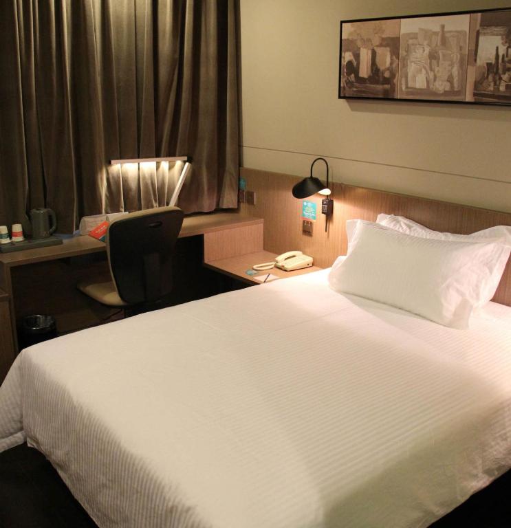 Vuode tai vuoteita majoituspaikassa Jinjiang Inn Shenyang Zhongshan Park