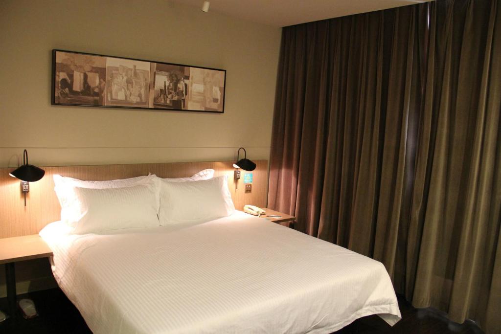 Vuode tai vuoteita majoituspaikassa Jinjiang Inn Shenyang Zhongshan Park