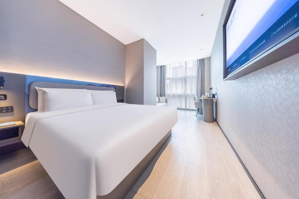 Postel nebo postele na pokoji v ubytování Atour Light Hotel Shanghai Daning International Shibei High-tech Park