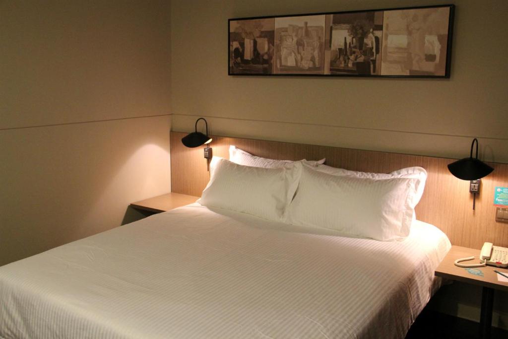 Vuode tai vuoteita majoituspaikassa Jinjiang Inn Shenyang Zhongshan Park