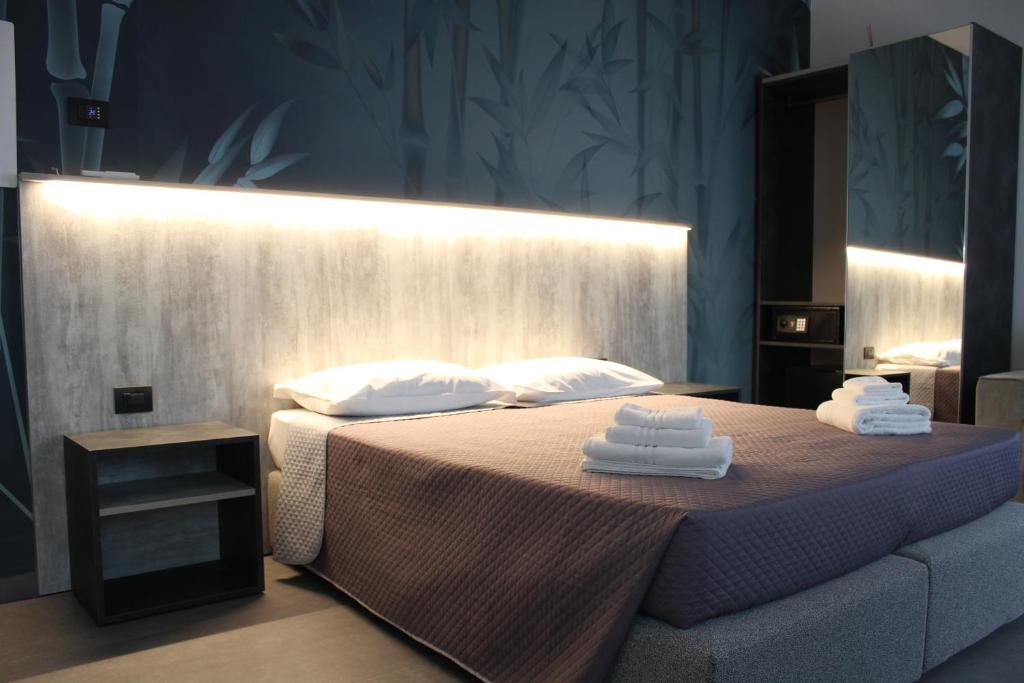 Postel nebo postele na pokoji v ubytování Hotel Paradiso