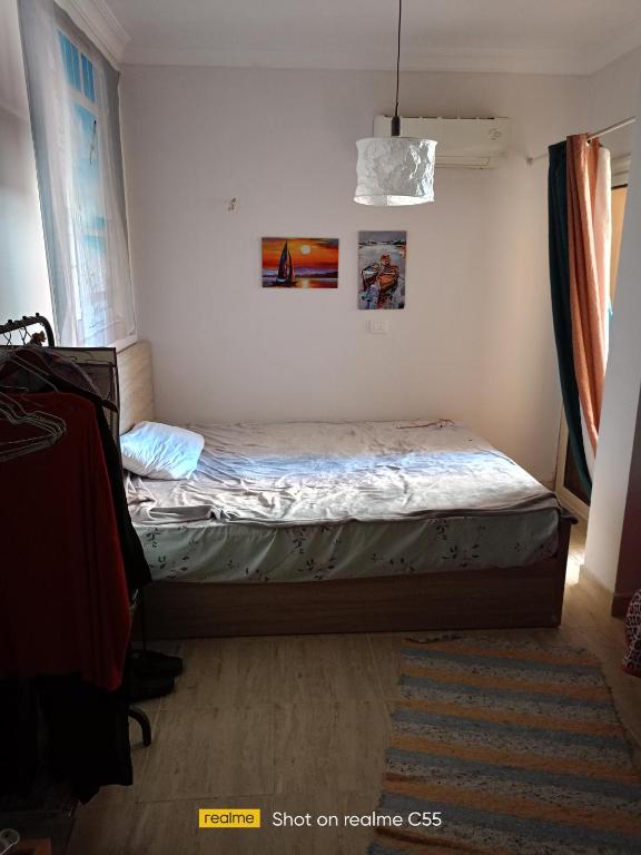 Ένα ή περισσότερα κρεβάτια σε δωμάτιο στο Cairo house