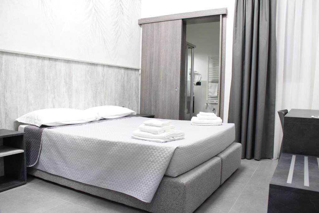Postel nebo postele na pokoji v ubytování Hotel Paradiso