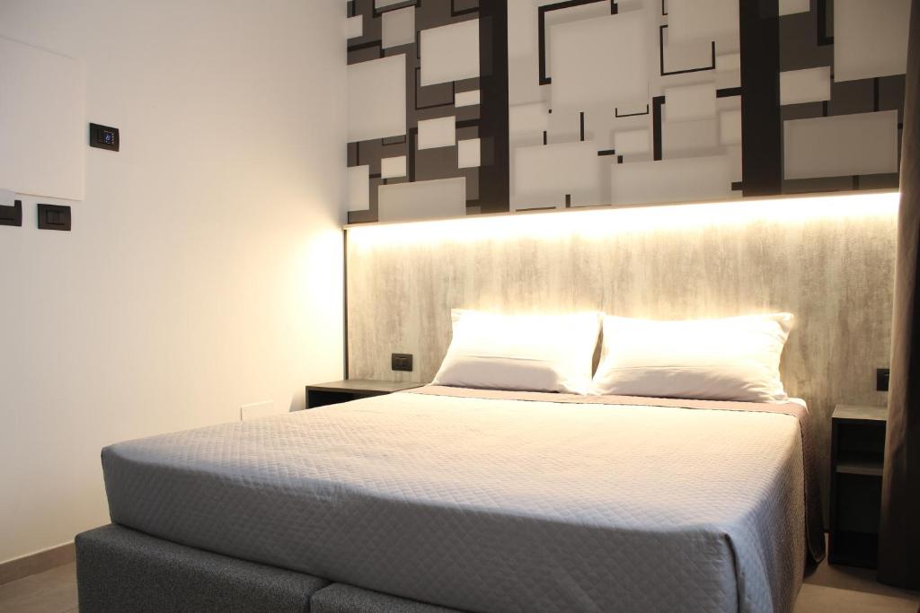 Postel nebo postele na pokoji v ubytování Hotel Paradiso