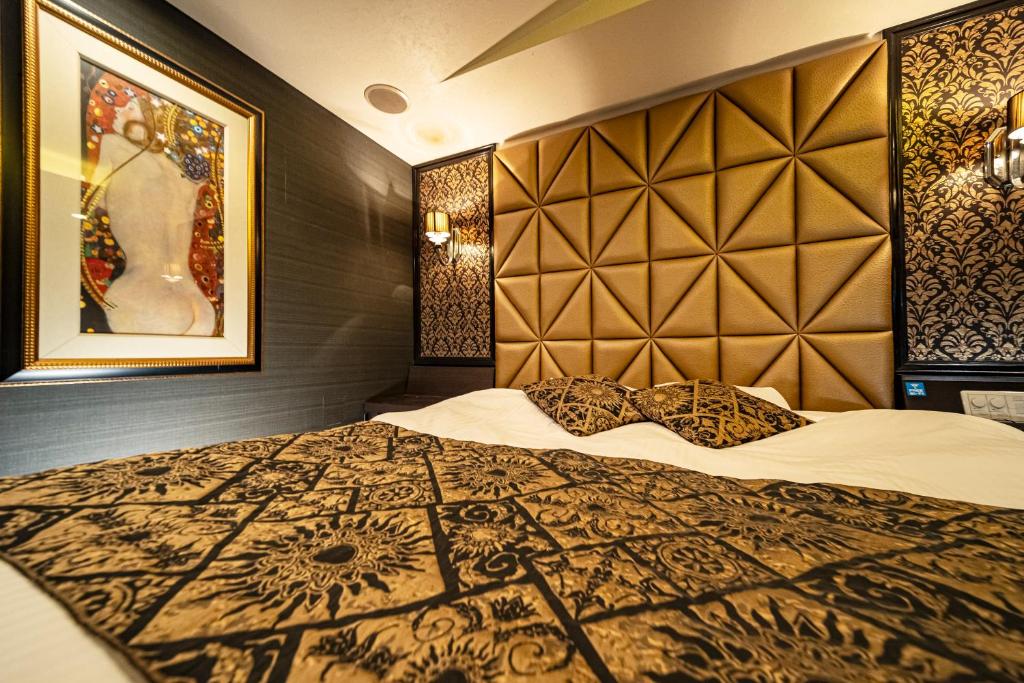 Postel nebo postele na pokoji v ubytování Hotel MINT Osaka Airport