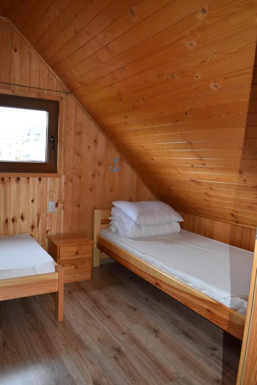 Postel nebo postele na pokoji v ubytování Promyk