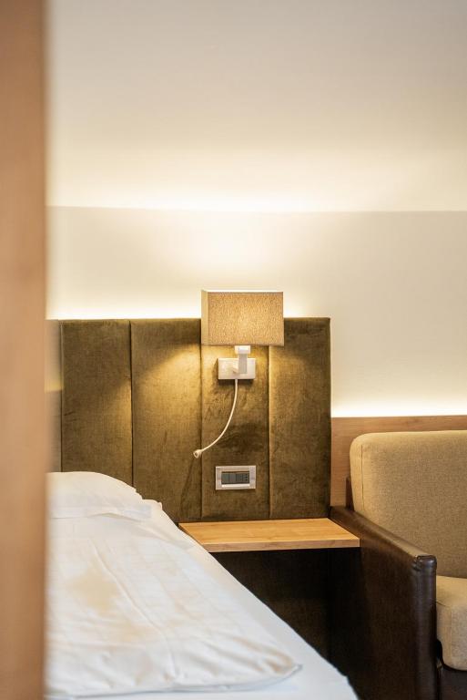 Postel nebo postele na pokoji v ubytování Hotel Brunnhofer