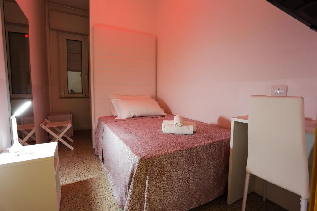 Postel nebo postele na pokoji v ubytování Hotel Ninfea Cattolica