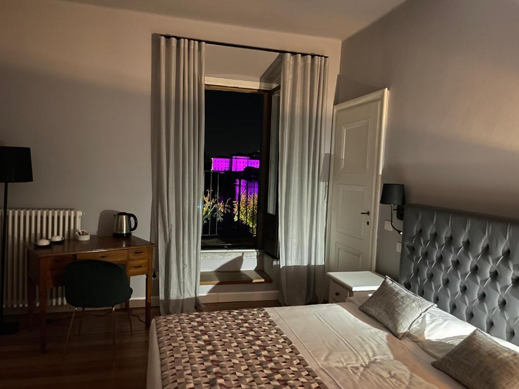 Postel nebo postele na pokoji v ubytování Villa Toscanini