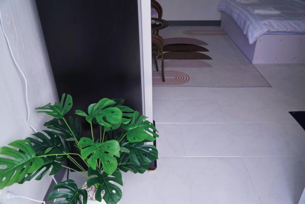 Postel nebo postele na pokoji v ubytování ฟ้ารีสอร์ต FAH Resort