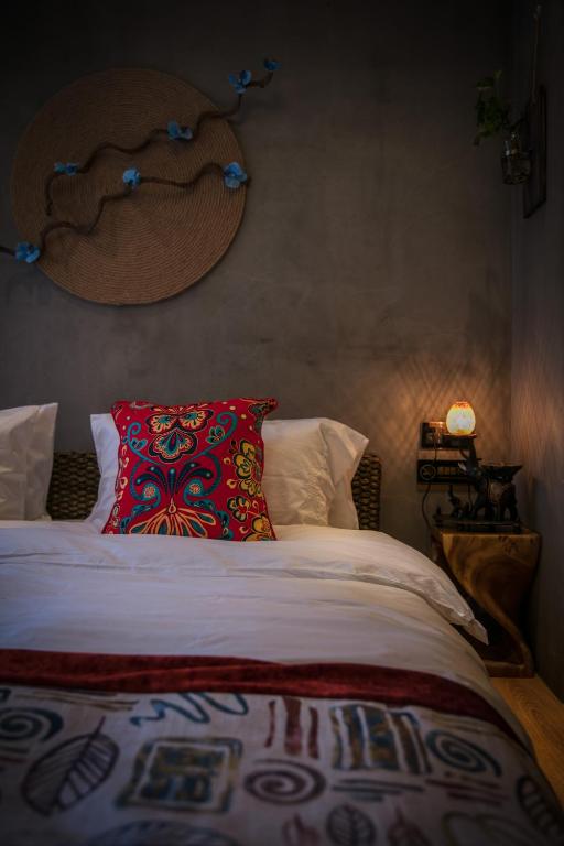 Postel nebo postele na pokoji v ubytování Bed and Breakfast B&B Qianxi 浅喜 SanYa