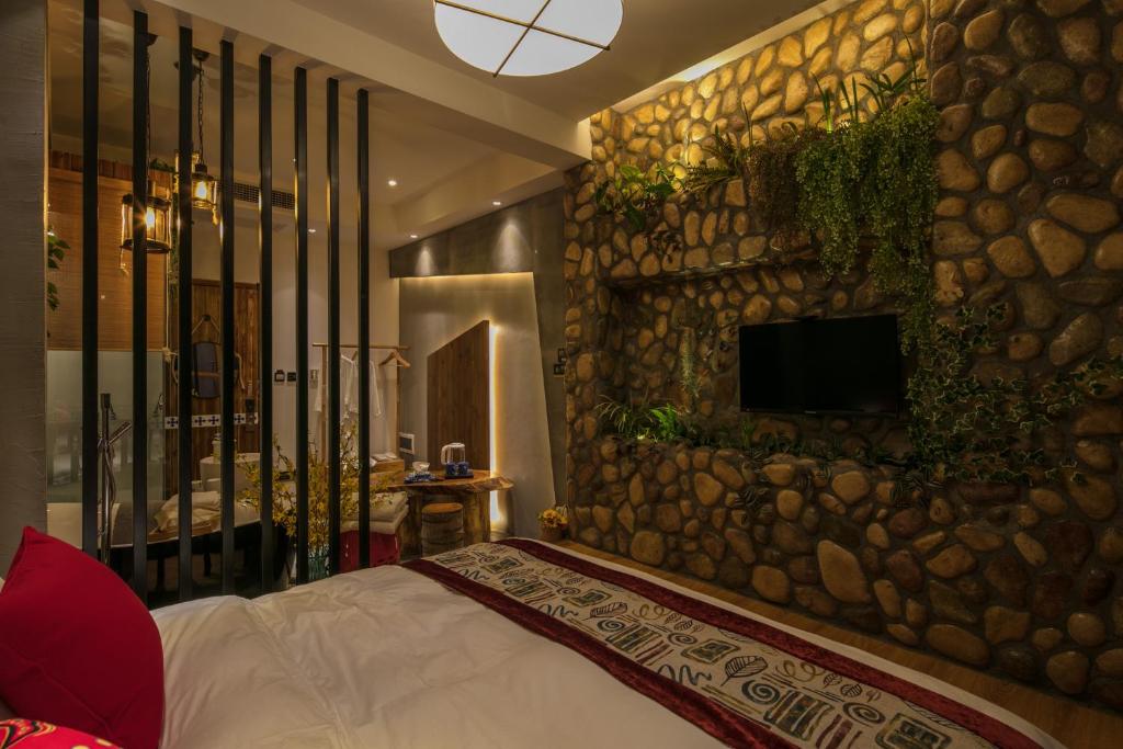 Postel nebo postele na pokoji v ubytování Bed and Breakfast B&B Qianxi 浅喜 SanYa
