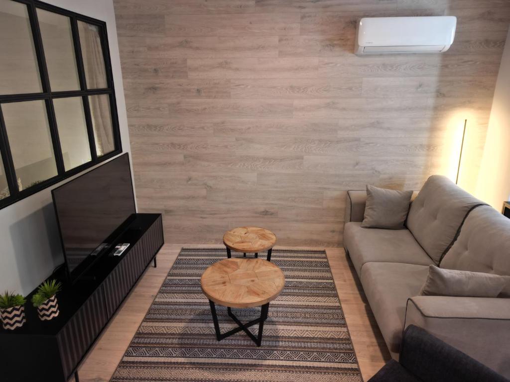 a living room with a couch and a table at Apartament Senyors de la Sal in Cardona