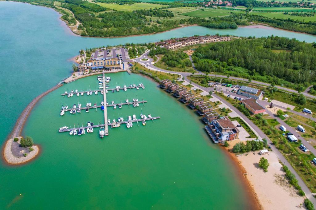 an aerial view of a marina with boats in the water at Lagovida Das Ferienresort Am Störmthaler See in Großpösna
