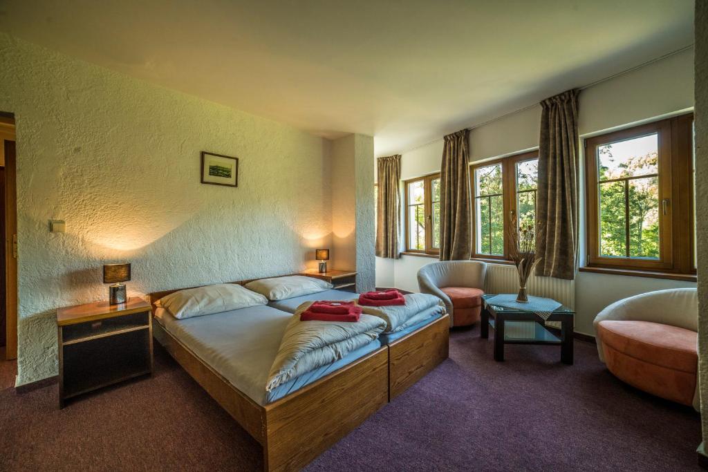 Postel nebo postele na pokoji v ubytování Hotel Pivovarská bašta