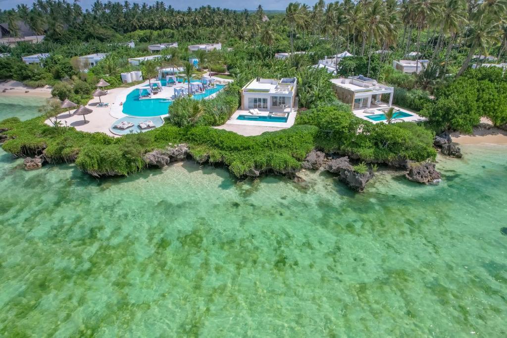 an island in the ocean with a resort at Ycona Eco-Luxury Resort, Zanzibar in Dikoni