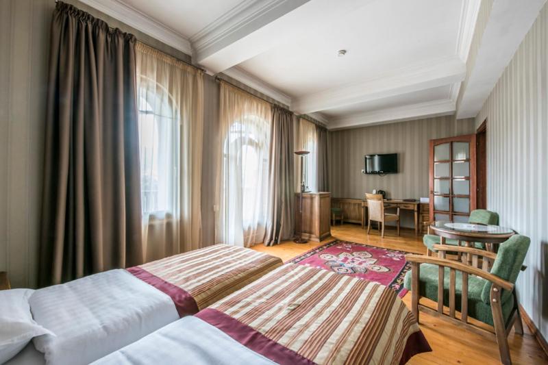 Postel nebo postele na pokoji v ubytování Hotel Kopala