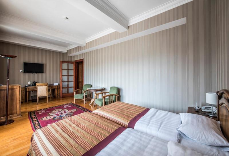 Postel nebo postele na pokoji v ubytování Hotel Kopala