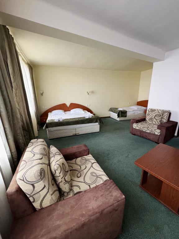 Postel nebo postele na pokoji v ubytování Blue Sevan Hotel