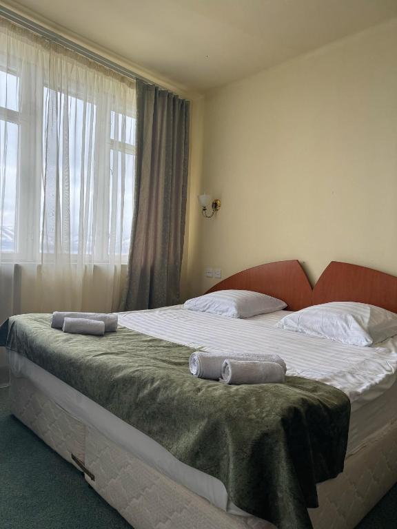 Postel nebo postele na pokoji v ubytování Blue Sevan Hotel