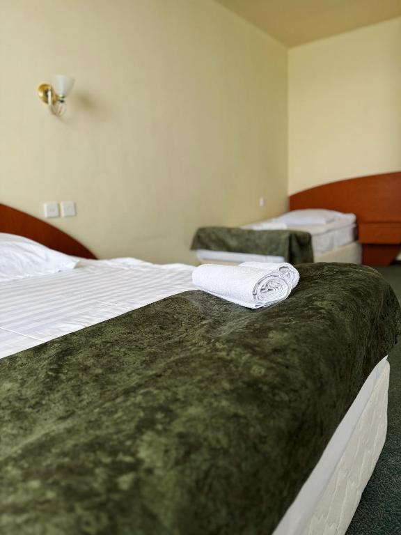 Postel nebo postele na pokoji v ubytování Blue Sevan Hotel