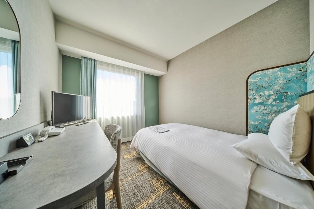 TV a/nebo společenská místnost v ubytování Hotel Flora Funabashi