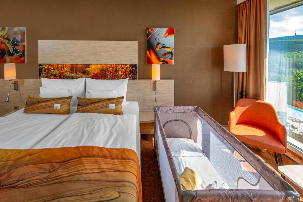Postel nebo postele na pokoji v ubytování Lifestyle Hotel Mátra