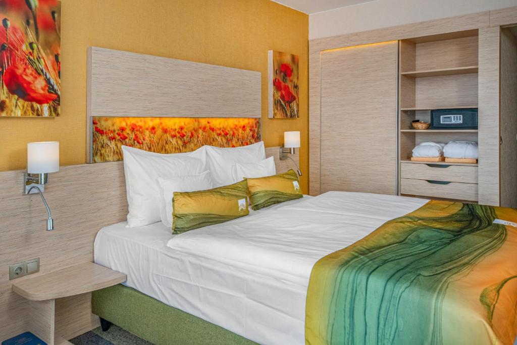 Postel nebo postele na pokoji v ubytování Lifestyle Hotel Mátra