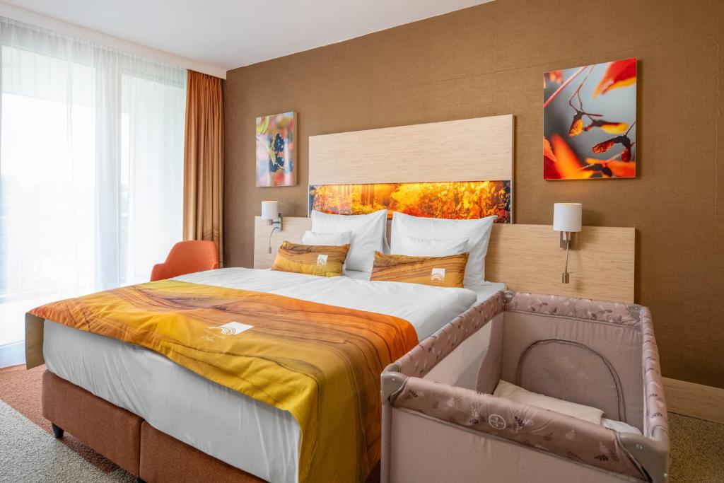 Postel nebo postele na pokoji v ubytování Lifestyle Hotel Mátra